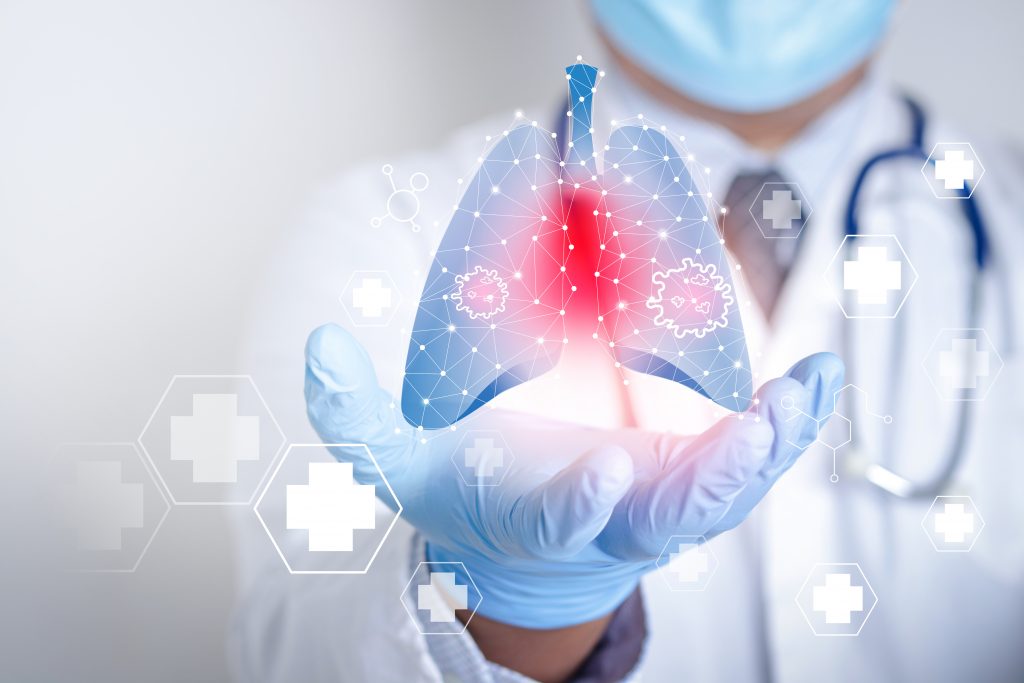 Doctors wearing masks and gloves Shows a graphical computer 